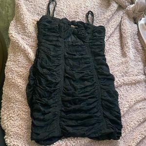 Black, mini dress, twisted top, zipper back, stretchy mesh like material.